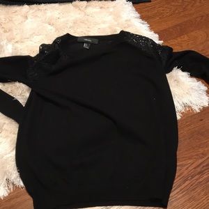 Women’s black sweater with lace on the shoulders